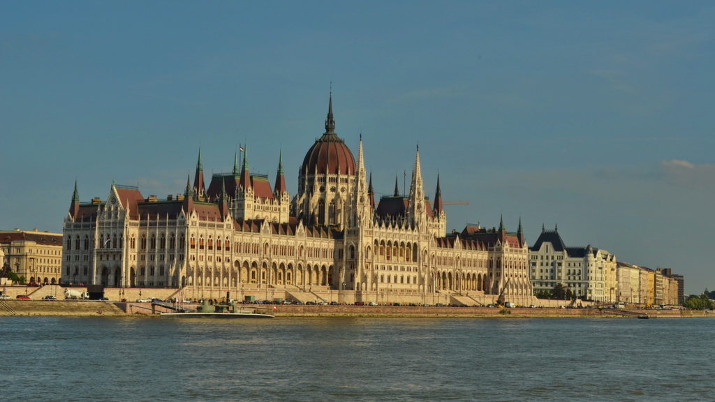 The Hungarian Parliament building by the Danube River at dusk.