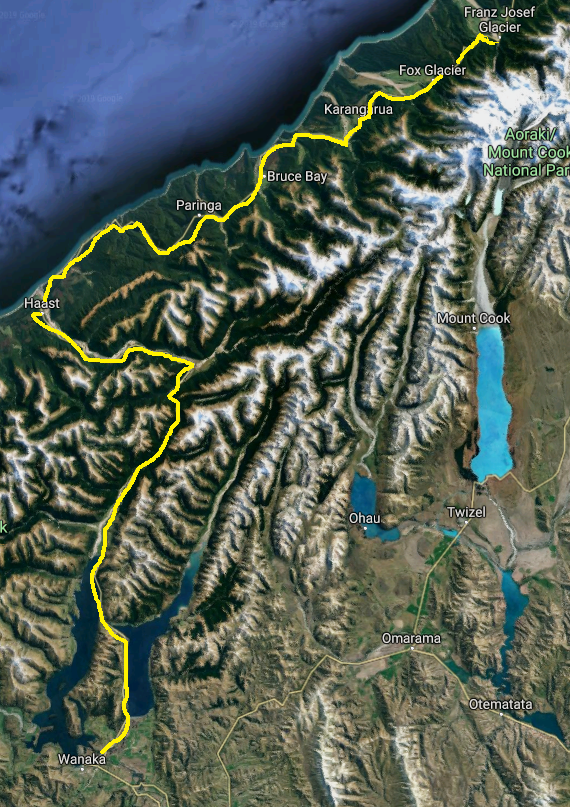 Satellite map showing a mountainous region with marked borders and lakes.