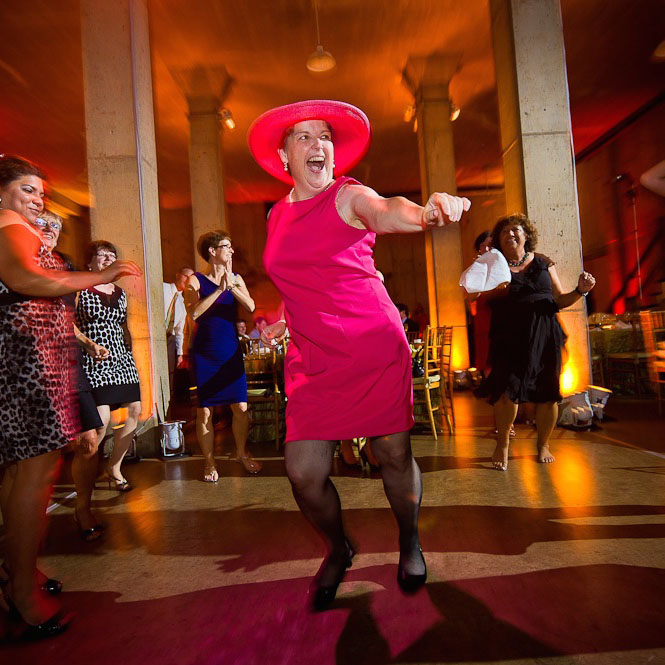 A lush green valley with a river flowing through mountainous terrain under a cloudy sky.