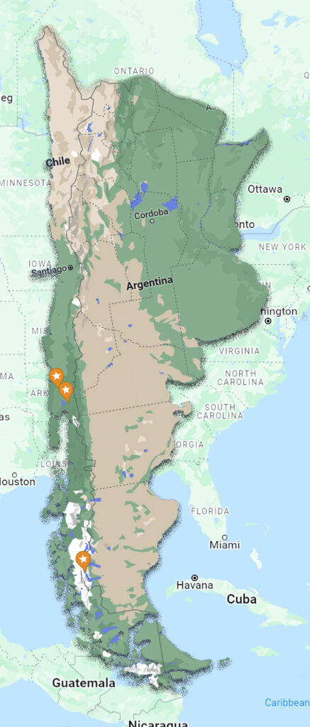 A lush green valley with a river flowing through mountainous terrain under a cloudy sky.