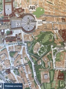 A lush green valley with a river flowing through mountainous terrain under a cloudy sky.