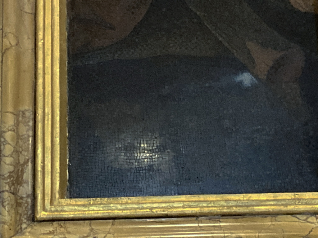 A lush green valley with a river flowing through mountainous terrain under a cloudy sky.